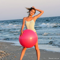 Posing on a sandy shore