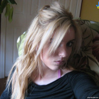 Blonde babe goes for some topless pose