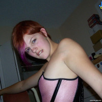 Pink hair cutie in a tight corset