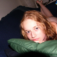Petite redhead teen shows her tits