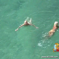 Cute naked blonde enjoys the cold water