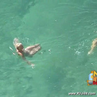 Cute naked blonde enjoys the cold water