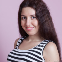 Dalila masturbates on her purple sofa
