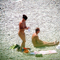 Busty redhead likes to go for a swim