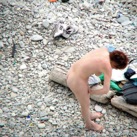Busty redhead likes to go for a swim
