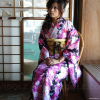 Asian Chiaki fucks her hairy pussy with toys under colorful kimono