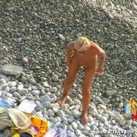 Fine blonde model walks naked teasing young boys