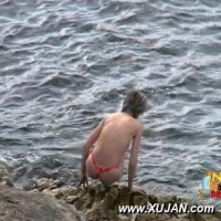 Brunette in a pink bikini is ready for a swim