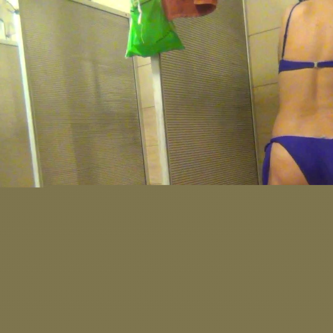 Washing her naked body and puting on a bikini
