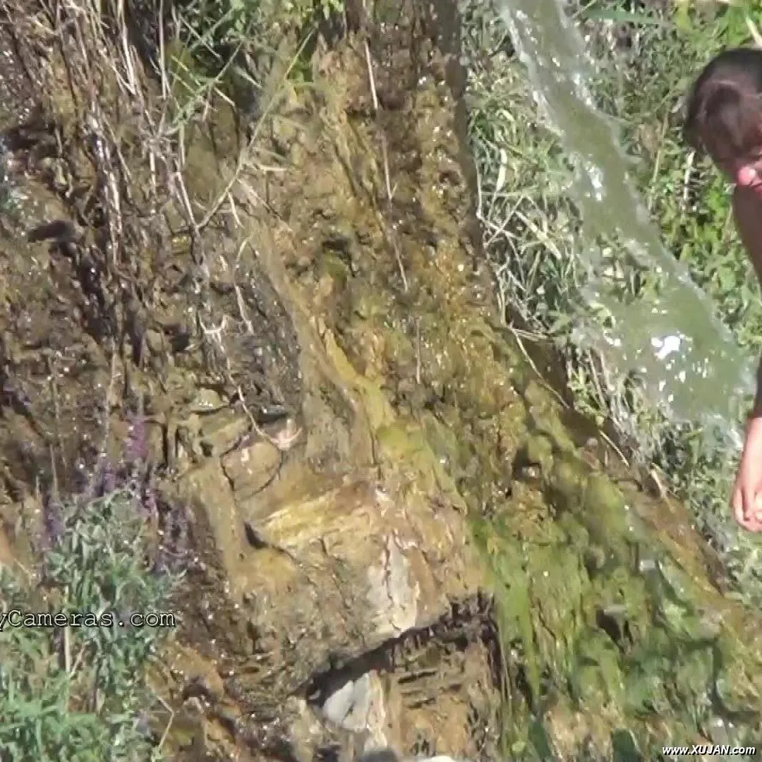 Tasty brunette washes her hands with cold water in nature - Photo #161116