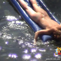 Mature brunette takes a long relaxing swim naked