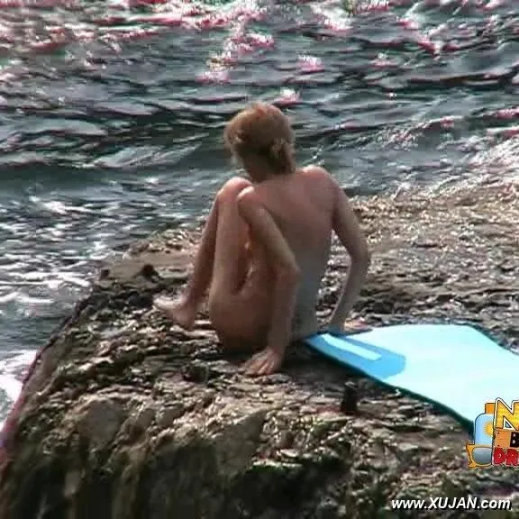 Busty blonde enjoys swimming in big waves - Photo #168478