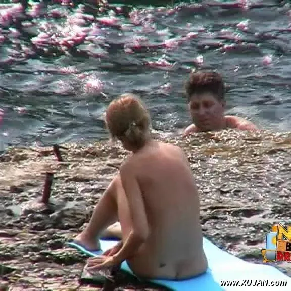 Busty blonde enjoys swimming in big waves - Photo #168485