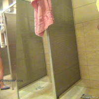 Spreading her legs wide to get everything washed