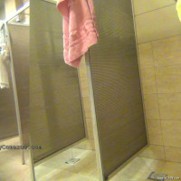 Spreading her legs wide to get everything washed