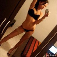 Very sexy babe making pics of herself at home