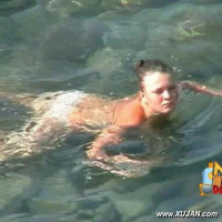 Kinky dark hair model has fun in the water