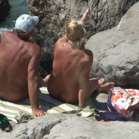 Busty blonde is filmed as she gets dressed