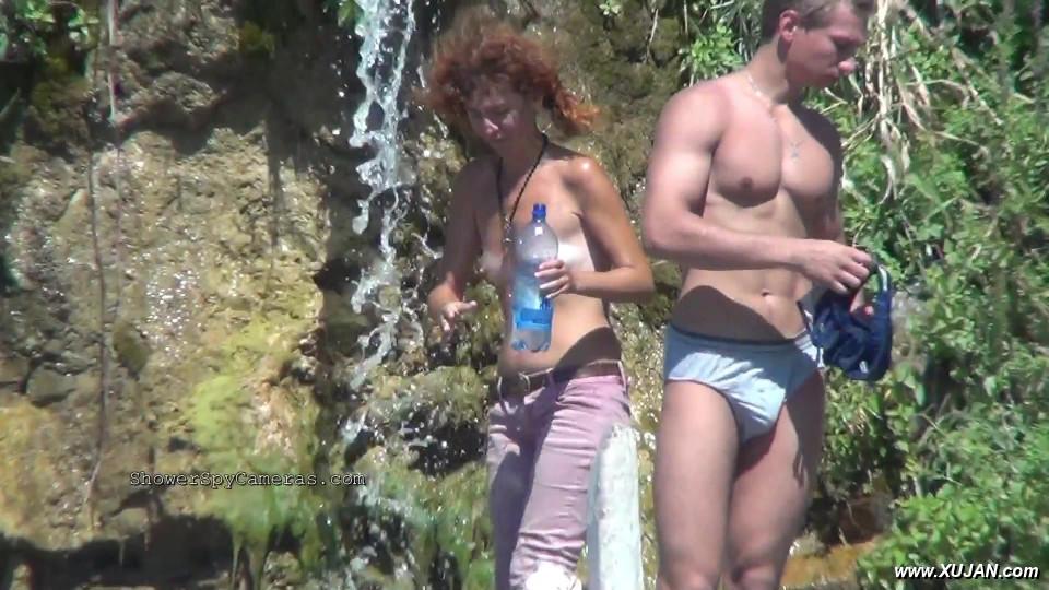 Tanned curly lady prancing around beside her young boy - Photo #240588