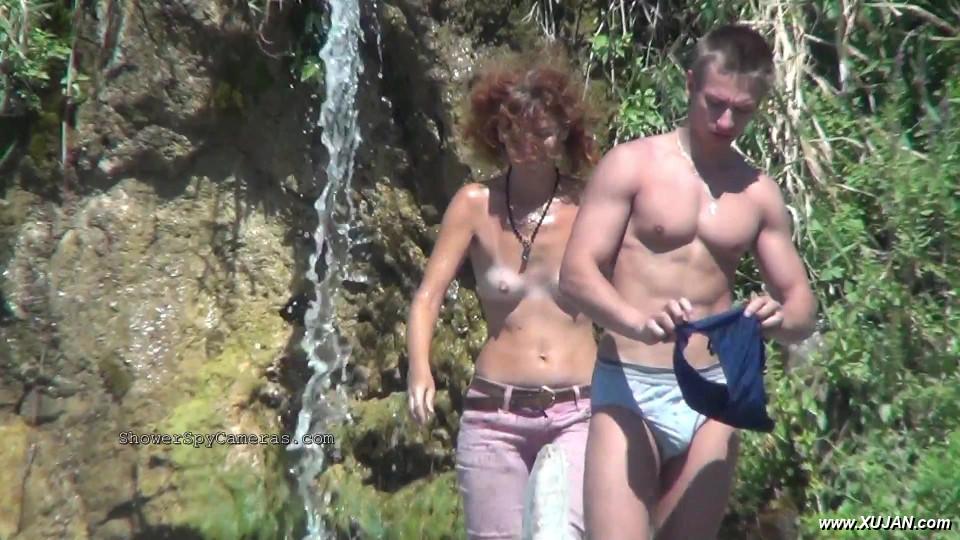 Tanned curly lady prancing around beside her young boy - Photo #240589