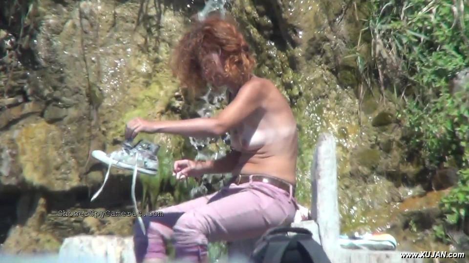 Tanned curly lady prancing around beside her young boy - Photo #240592