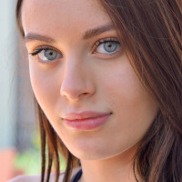 Lana Rhoades posing while wearing sexy shorts during a hike