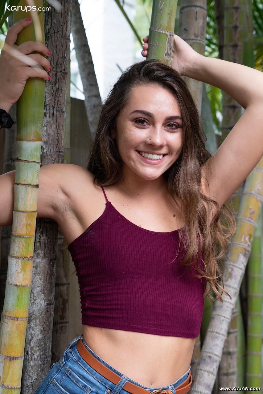 Amateur chick Mackenzie Mace gets naked on a patio next to some trees - Photo #298337