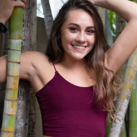 Amateur chick Mackenzie Mace gets naked on a patio next to some trees