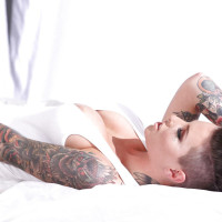 Tattooed knockout Christy Mack uncovering her flalwless curves