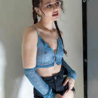 Liz Jordan wears her glasses during a blowbang in an adult video store