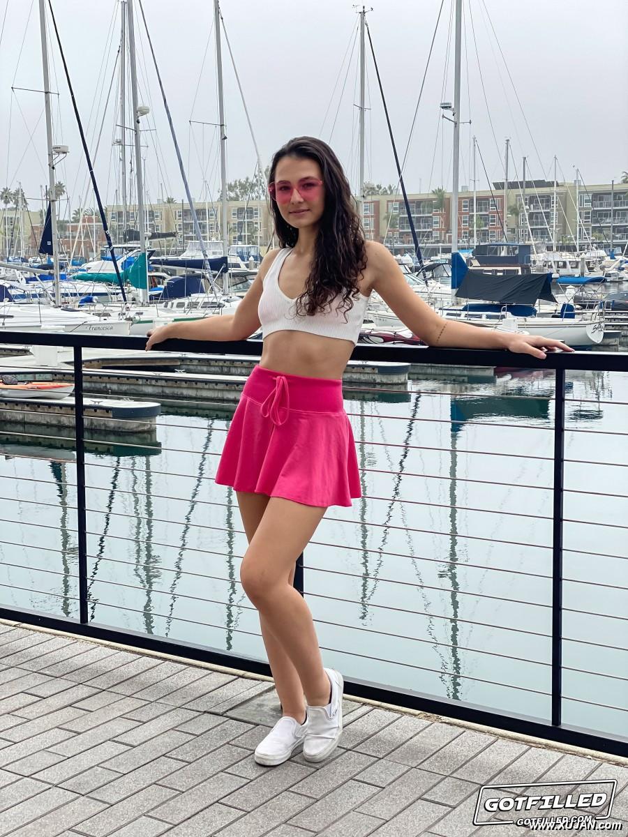 Young brunette Liz Jordan models a bikini at a marina before sex at home - Photo #310012