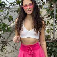 Young brunette Liz Jordan models a bikini at a marina before sex at home