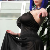 Goth girl Larkin Love cups her great tits while modeling solo