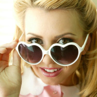 Blonde babe Lexi Belle takes off her sexy uniform to show boobs