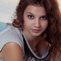 Flat chested teen Emma Sweet exposing shaved pussy if glamour shoot