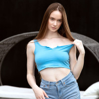 Tall young girl Hazel Moore gets completely naked in a backyard location
