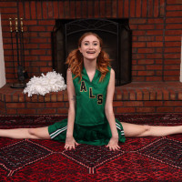 Young redheaded cheerleader Scarlet Skies gets naked for Kegel exercises