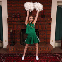 Young redheaded cheerleader Scarlet Skies gets naked for Kegel exercises