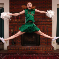 Young redheaded cheerleader Scarlet Skies gets naked for Kegel exercises
