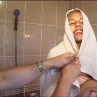 Rebecca washes herself and her natural tits while masturbating for us in the tub
