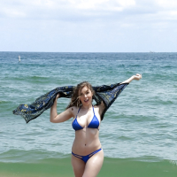 Beach babe Lena Paul freeing nice melons from bikini by swimming pool