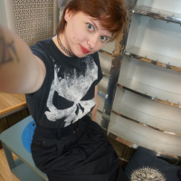 Sweet redhead gets naked in the office