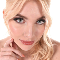 Naughty blondie Sylvia Buntarka strips and rubs all over her naked body