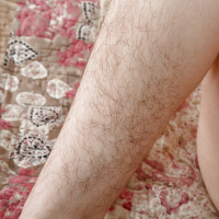 Aged brunette female Simone Delilah showing off hairy pits and legs