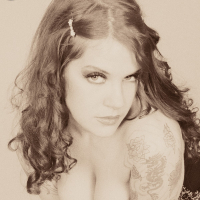 Classic Goth fetish Delilah shows off her corset