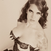 Classic Goth fetish Delilah shows off her corset