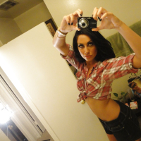 Brunette slut Tiffany Brookes taking mirror self shots while undressing