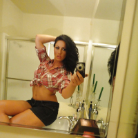 Brunette slut Tiffany Brookes taking mirror self shots while undressing