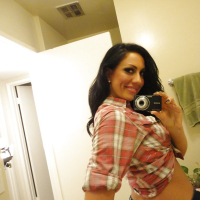 Brunette slut Tiffany Brookes taking mirror self shots while undressing