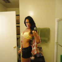 Brunette slut Tiffany Brookes taking mirror self shots while undressing